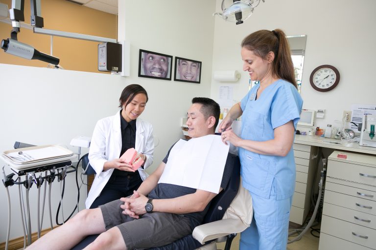 Dunbar dental Dr Anna Pranata seeing patient.