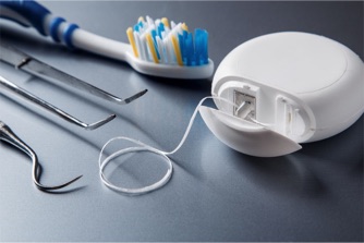 Image of dental equipment, tooth brush and dental floss
